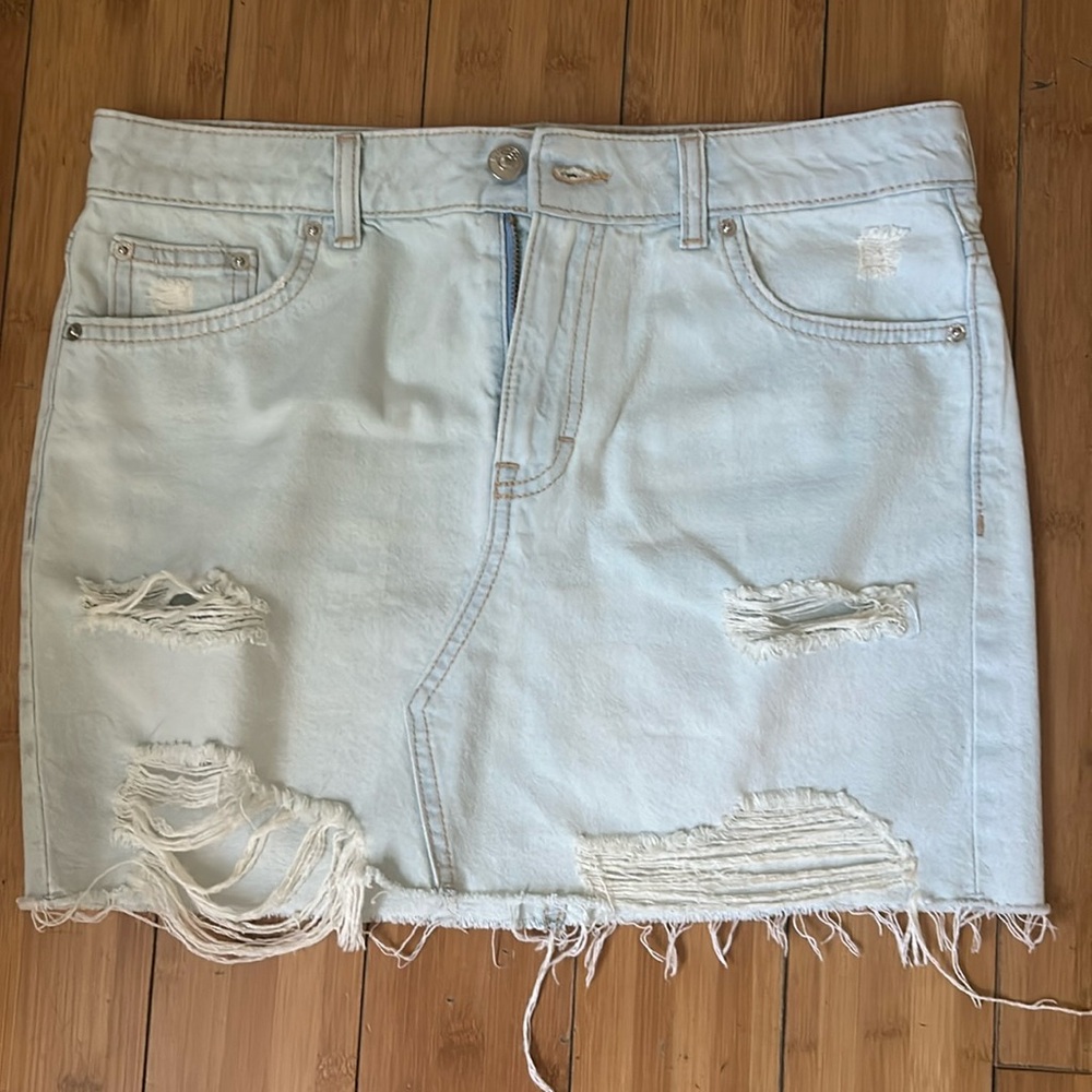 Distressed denim mini skirt
